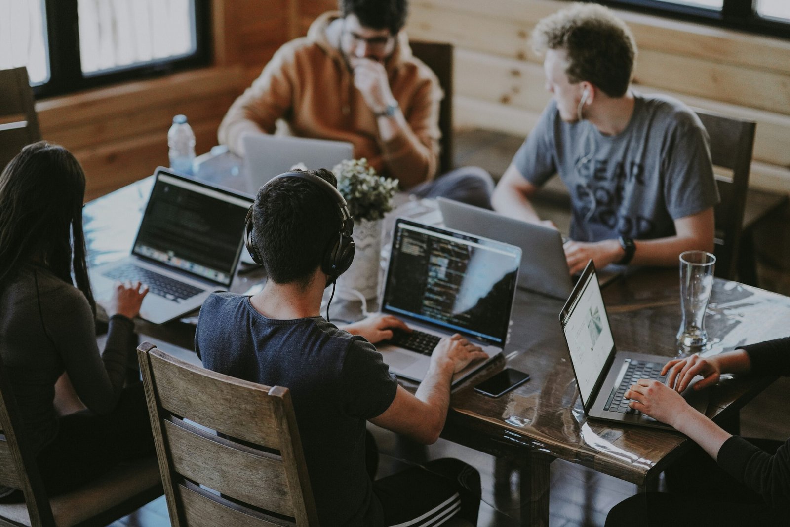 group of people using laptop computer